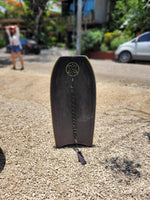 Load image into Gallery viewer, Black bodyboard with textured deck, photographed upright outside The Frog Pad in Nosara.
