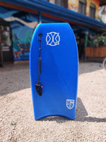 Load image into Gallery viewer, Blue professional bodyboard with leash available for rent at The Frog Pad in Nosara, Costa Rica.