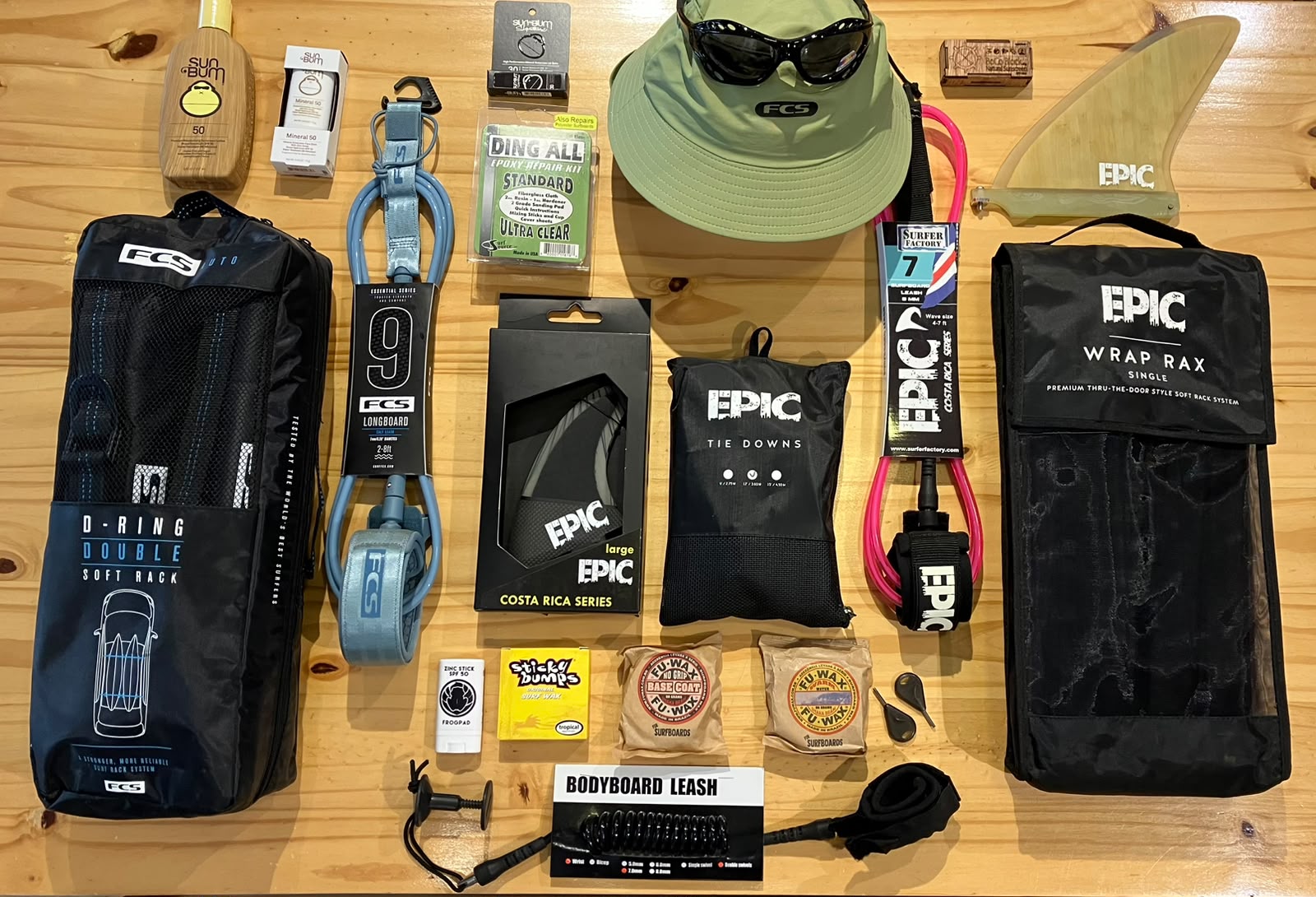 Surf accessories including leashes, fins, wax, repair kits, surf hats and roof rack straps at The Frog Pad in Nosara, Costa Rica.